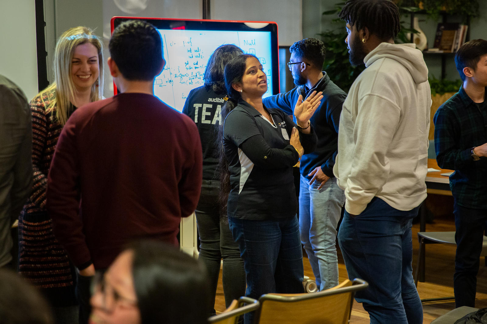 CTP students networking with Audible engineers at an in-person event. 